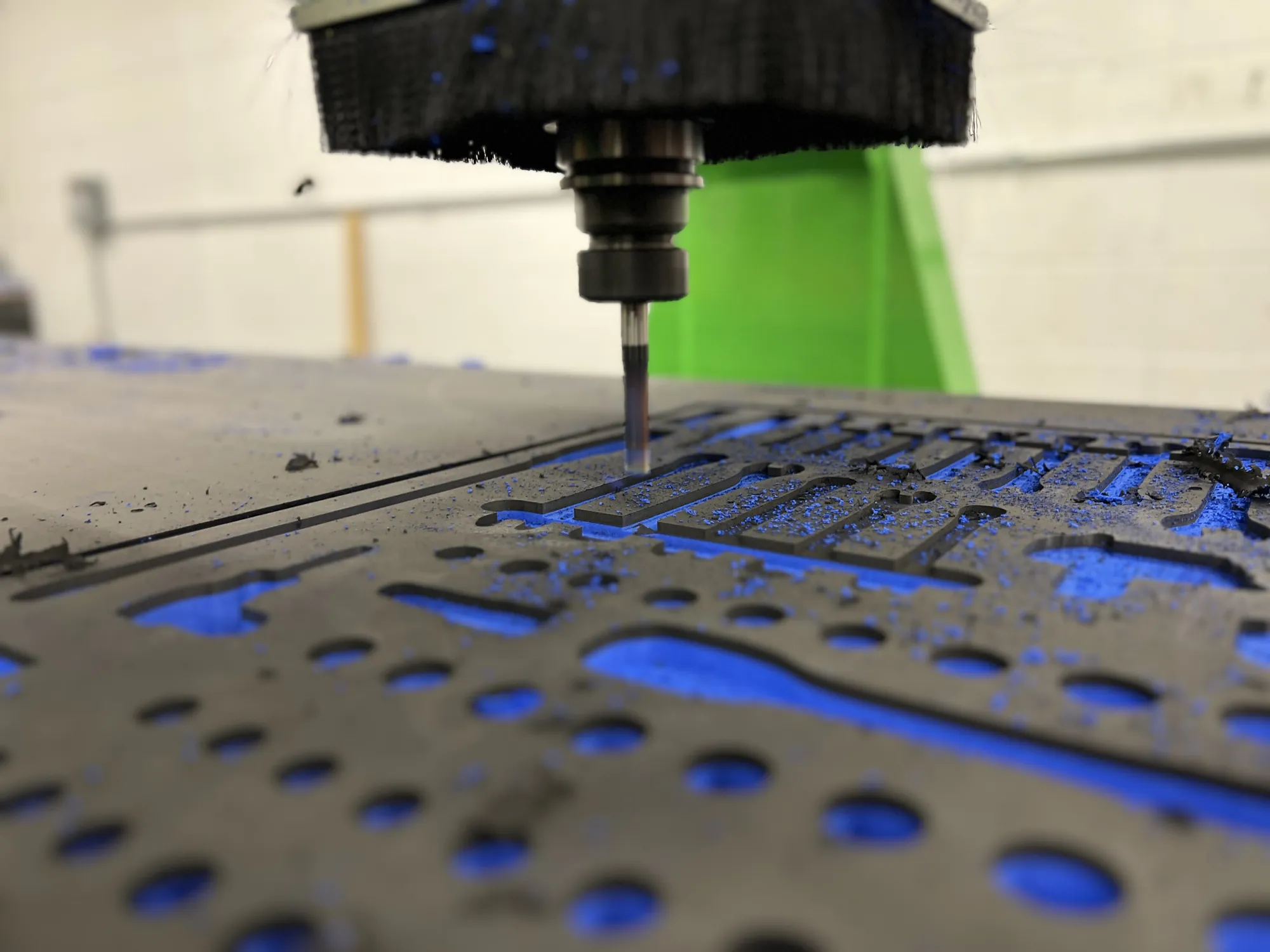 Cutting: Tool-shaped pockets being machined into the foam.